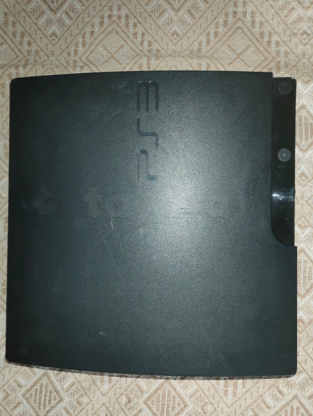 PS3 Slim + 2 manettes d'origine + 5 CD sà vendre